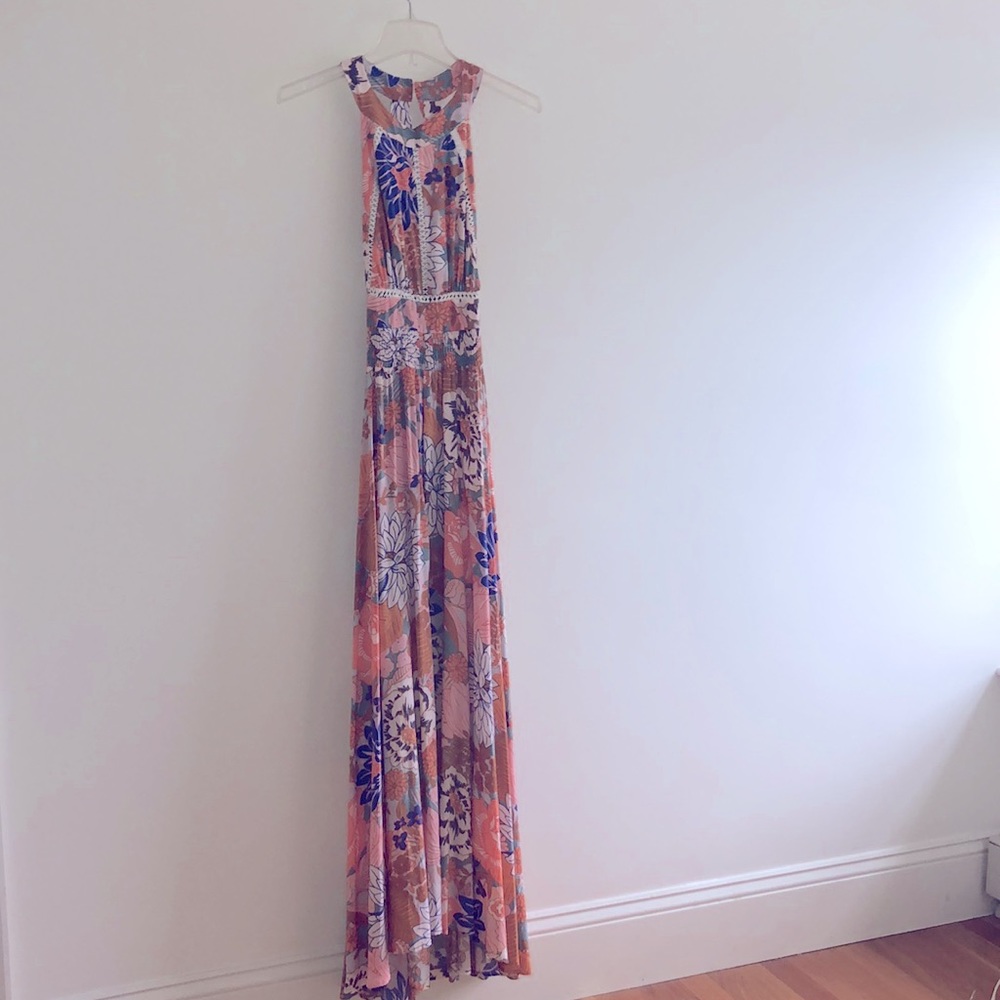Pretty floral dress. Slit in front. Almost new. Worn twice.